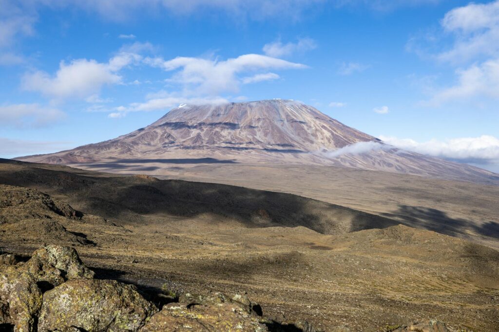 Breathtaking view of Mount Kilimanjaro under a clear blue sky, perfect for travel and adventure enthusiasts.